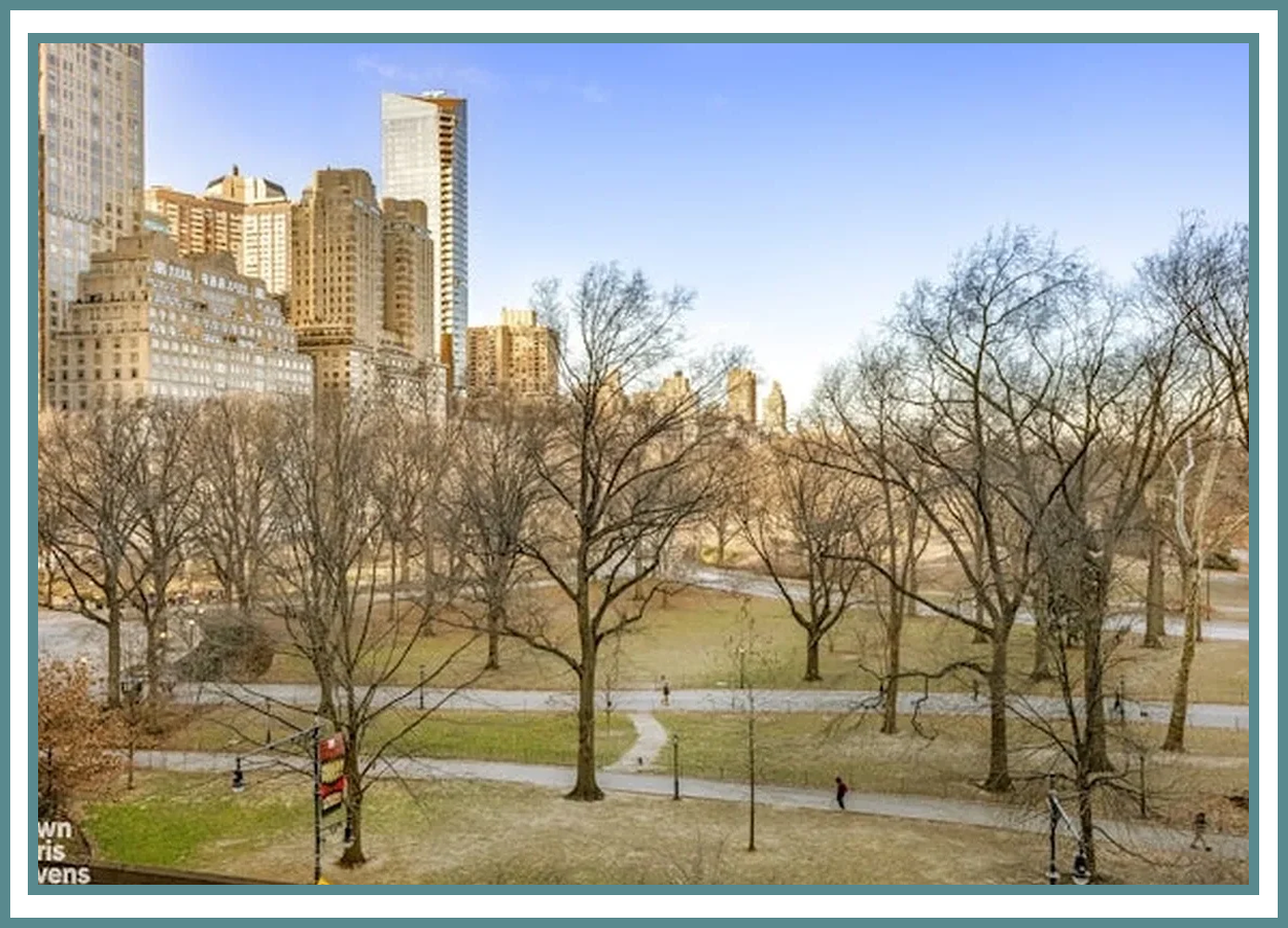 City park with trees and skyscrapers visible.