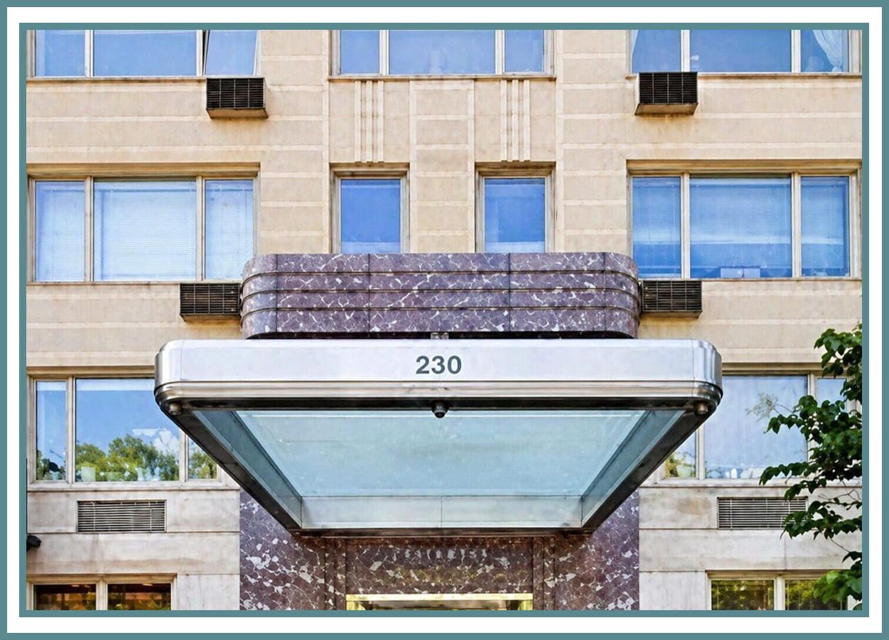 Building entrance with canopy and windows.