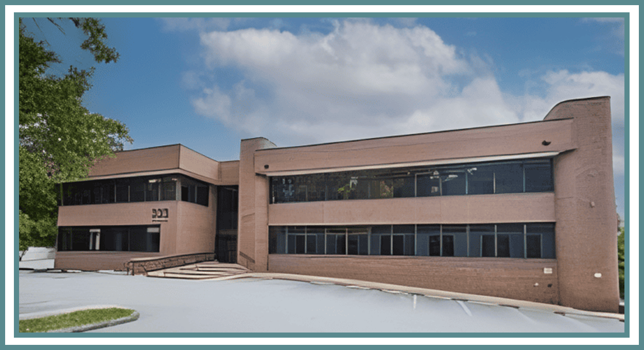 Two-story brick office building with windows.